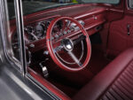 07 1957 Ford F 100 interior with burgundy leather bench and classic bright dash