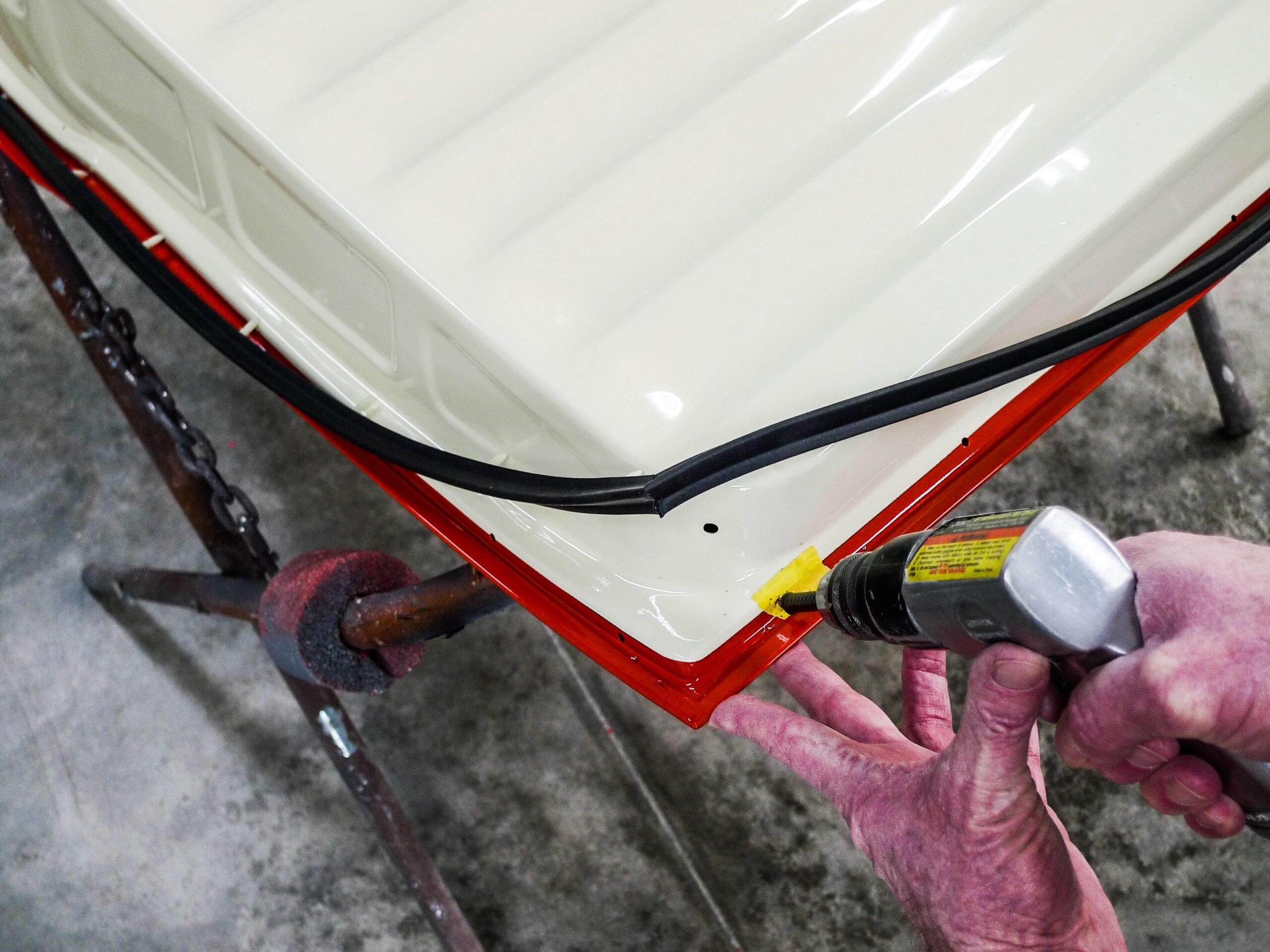 07 Drilling pilot holes for seal retainer on Chevy truck door panel