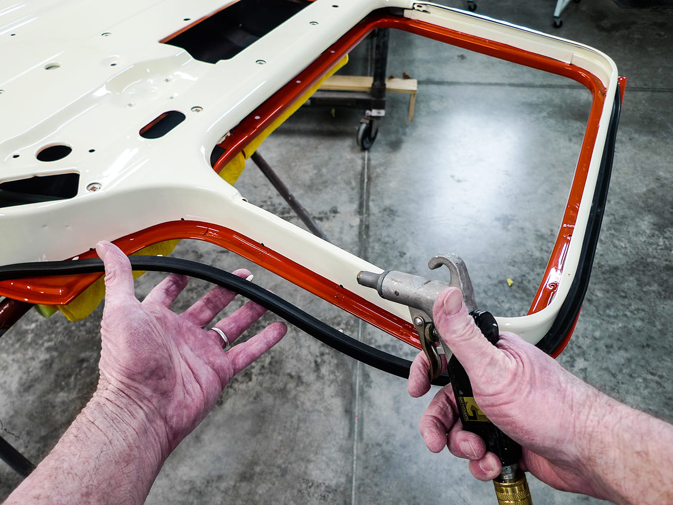 08 Using air tool to seat rubber weatherstrip on Chevy truck door