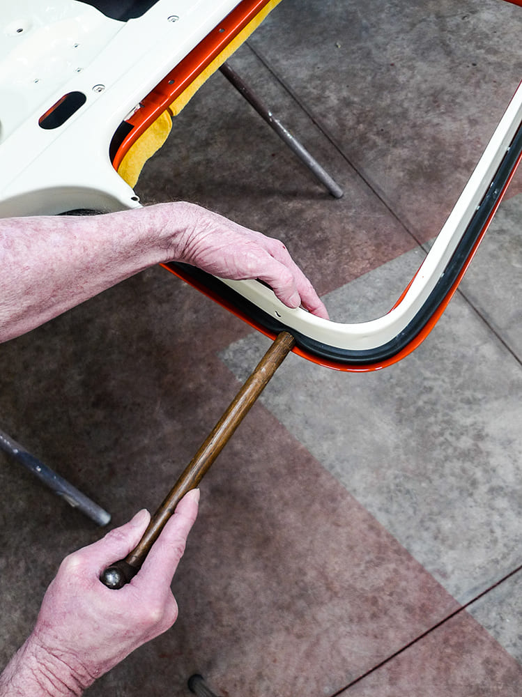 10 Seating rubber seal corner with wood tool for tight Chevy truck weatherstrip fit