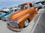 11 1950 Chevrolet 3100 in copper pearl with polished five spoke wheels and chrome grille