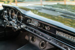 11 1959 Pontiac Catalina dash restored in gloss black with factory radio and dual Vintage Air vents