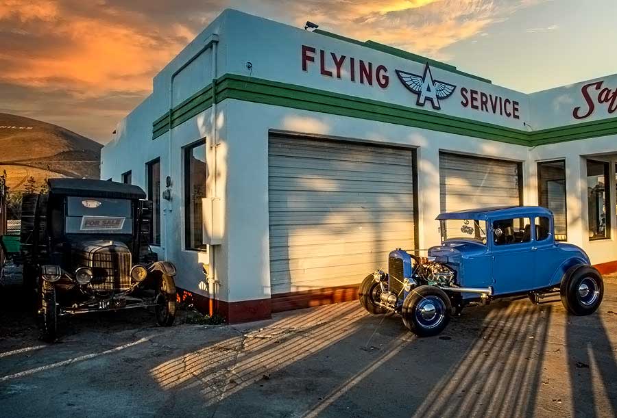 13 1930 ford model a coupe in front of flying service shop