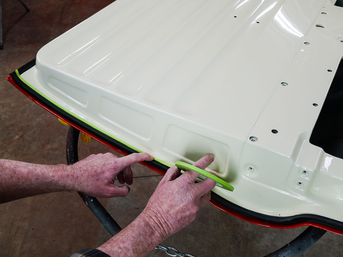 13 Aligning seal with green tape prep on classic Chevy truck door skin