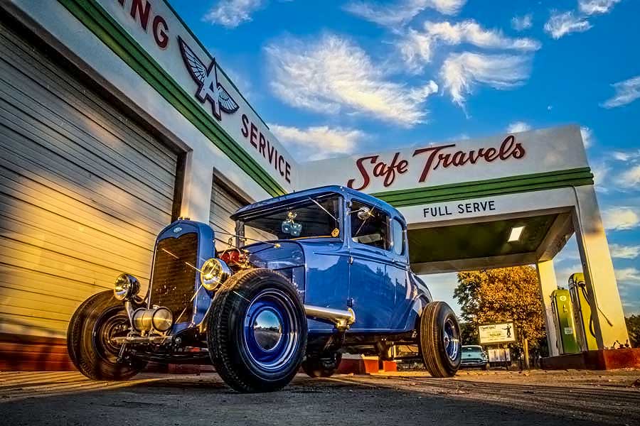 14 1930 ford model a coupe in front of flying service shop front view