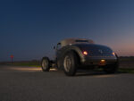 14 1936 Ford highboy low angle rear view with taillights illuminated and vintage plate