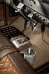 14 1956 Ford F 100 floor mounted shifter with leather boot and billet cupholders on carpeted console