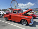 14 1959 Chevrolet Apache 3100 in vibrant red with custom wheels and detailed engine bay