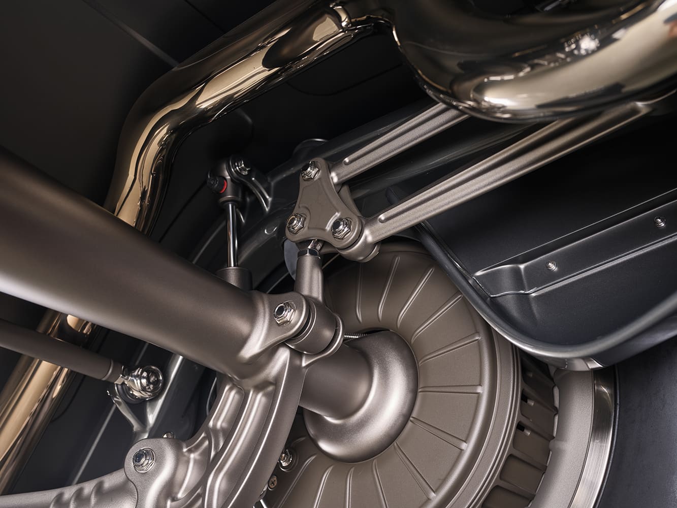 15 1936 Ford highboy rear suspension close up featuring polished exhaust and machined four bar links