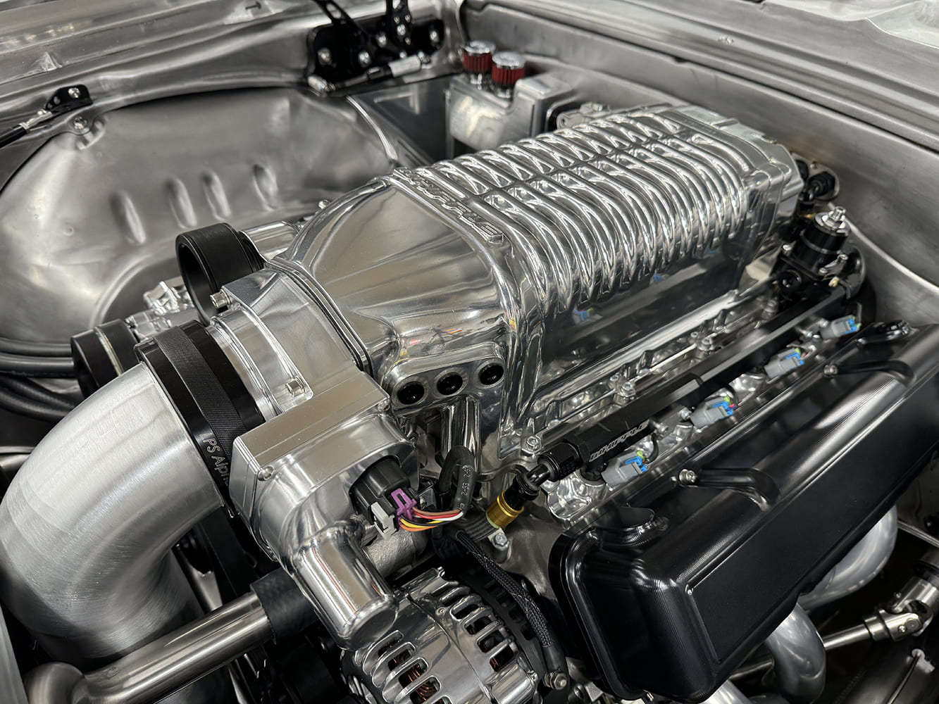 16 1969 Camaro Whipple blower front close up with alternator and billet bracketry