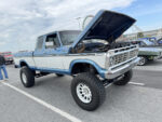 16 1976 Ford F 250 Crew Cab Highboy in two tone blue and white with lift kit and white wheels