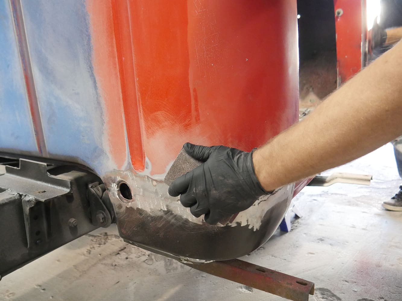 17 1956 Ford F 100 spraying weld through primer on prepped patch panel and cab edge