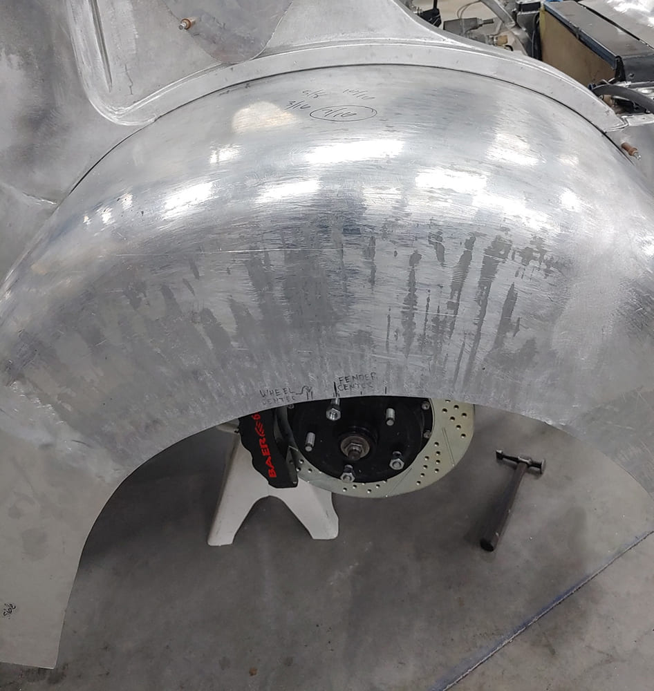 17 Divco front fender aluminum test fit reveals Baer brakes through wheel opening