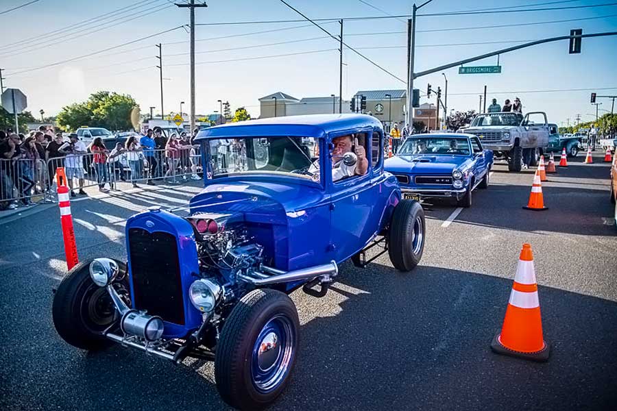18 1930 ford model a coupe driving down street