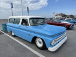 18 1966 Chevrolet Suburban in light blue and white two tone with lowered stance and dog dish caps