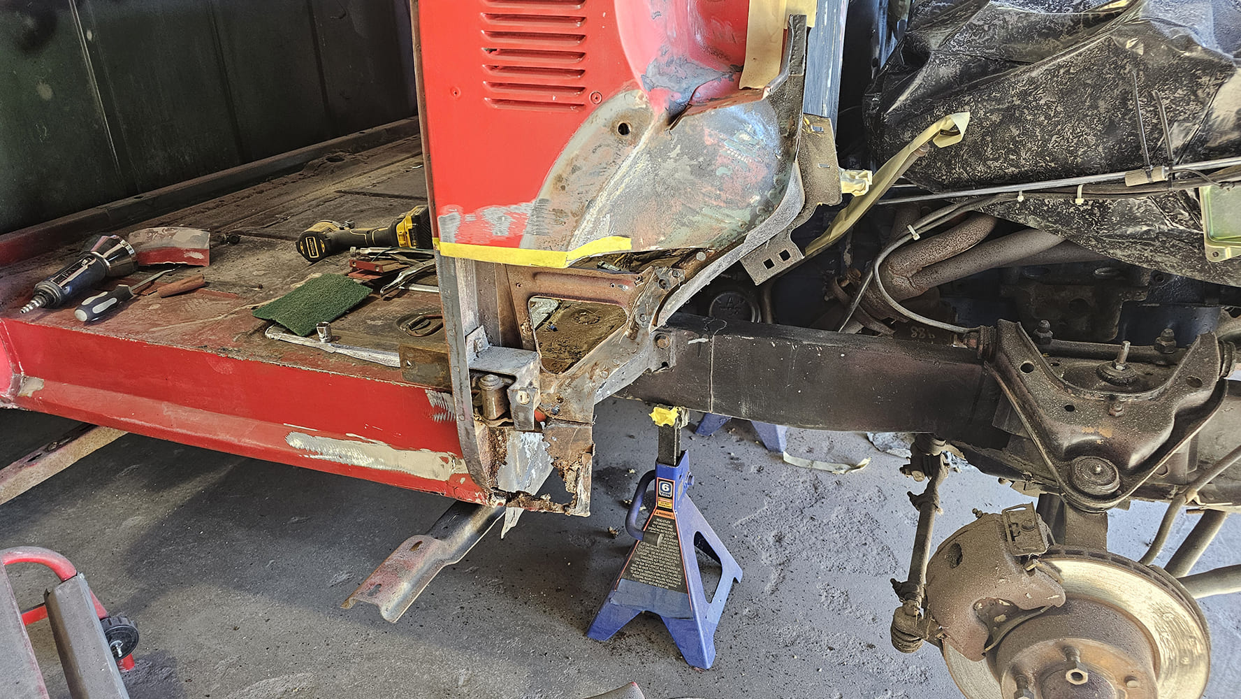 19 1956 Ford F 100 welding new steel section on passenger lower cab with MIG torch