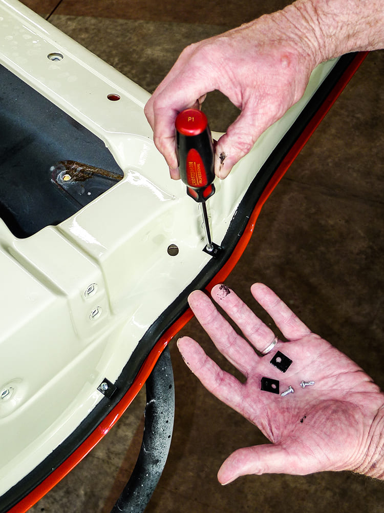 19 Phillips screw install of seal tabs with hardware kit on Chevy truck door