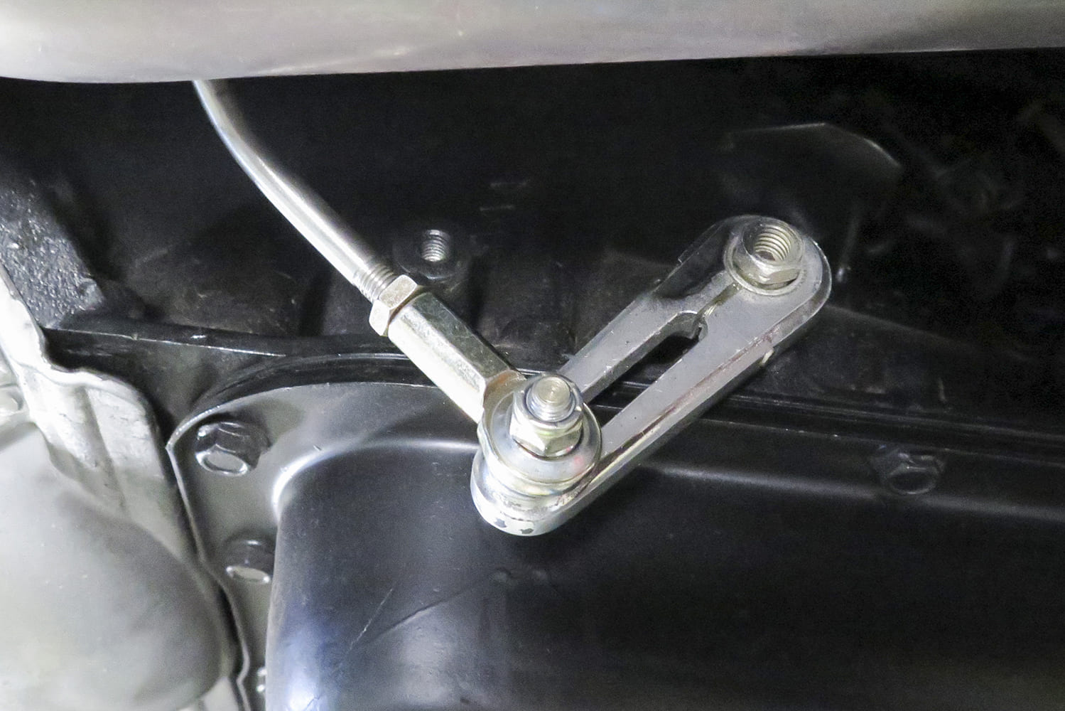 20 1972 Chevy C10 shift linkage rod connected to transmission shift lever with billet arm