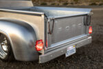 21 1956 Ford F 100 tailgate in raw brushed steel with vintage Ford lenses and leather tailgate straps