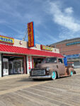 22 1951 GMC 100 in brown patina with turquoise wheels aired out on the Ocean City boardwalk