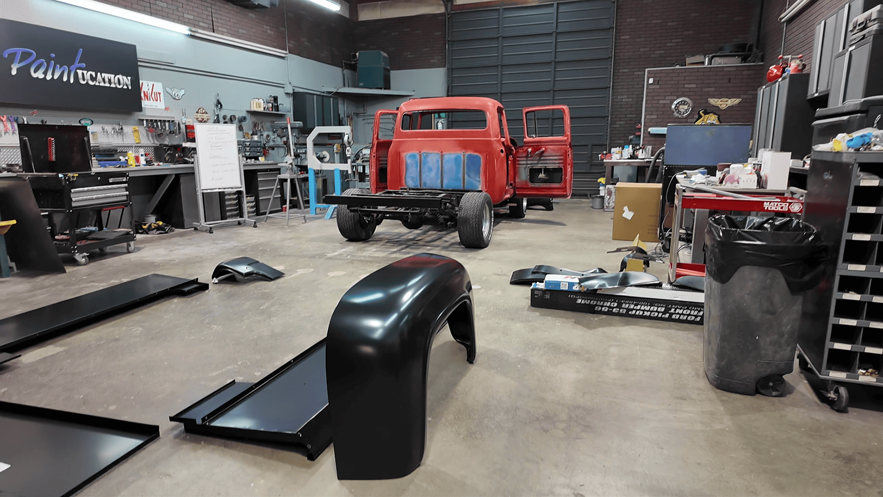 22 1956 Ford F 100 disassembled in shop with new fenders and bed panels laid out