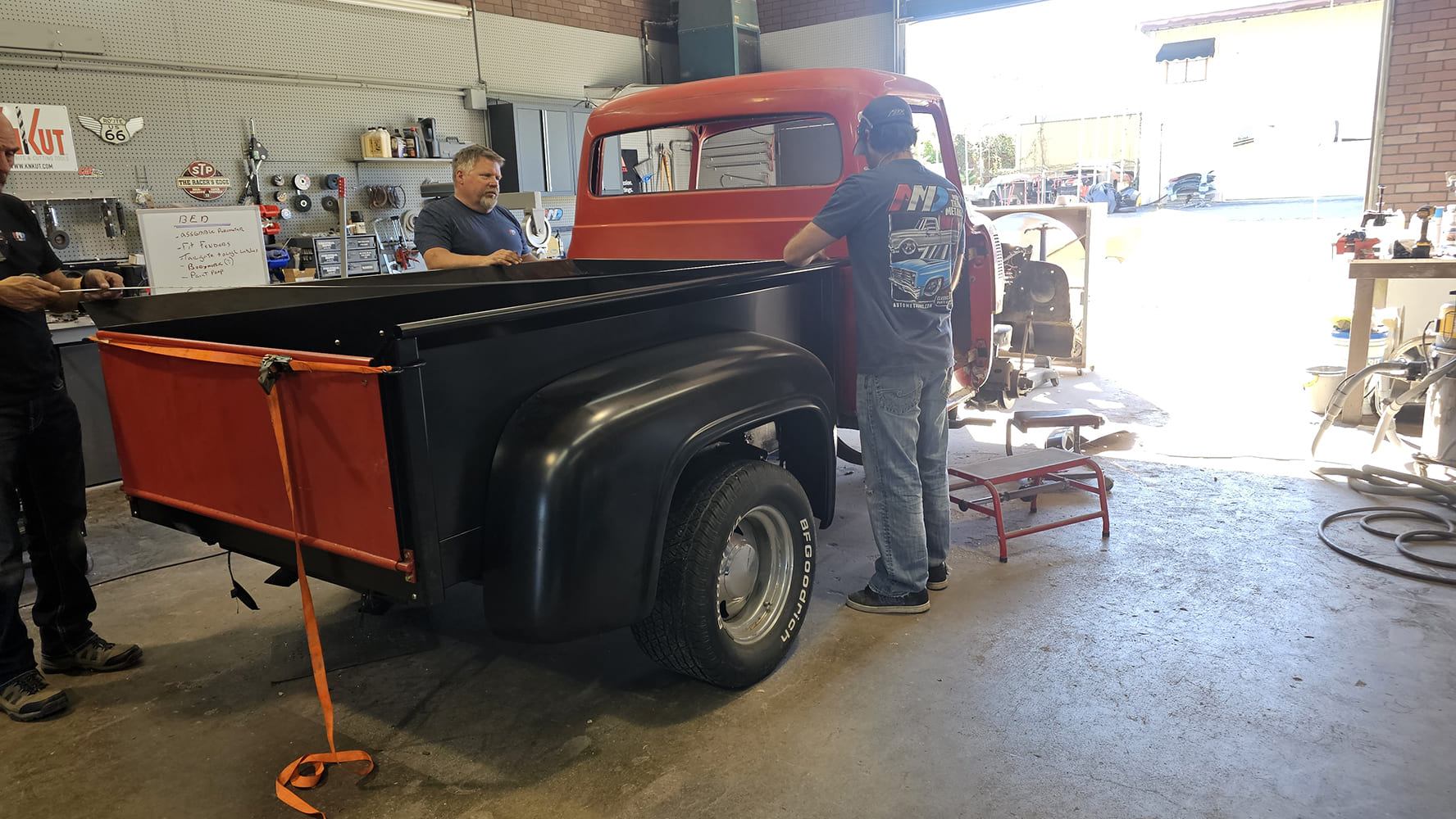 23 1956 Ford F 100 bed mockup with red cab and new black fenders aligned