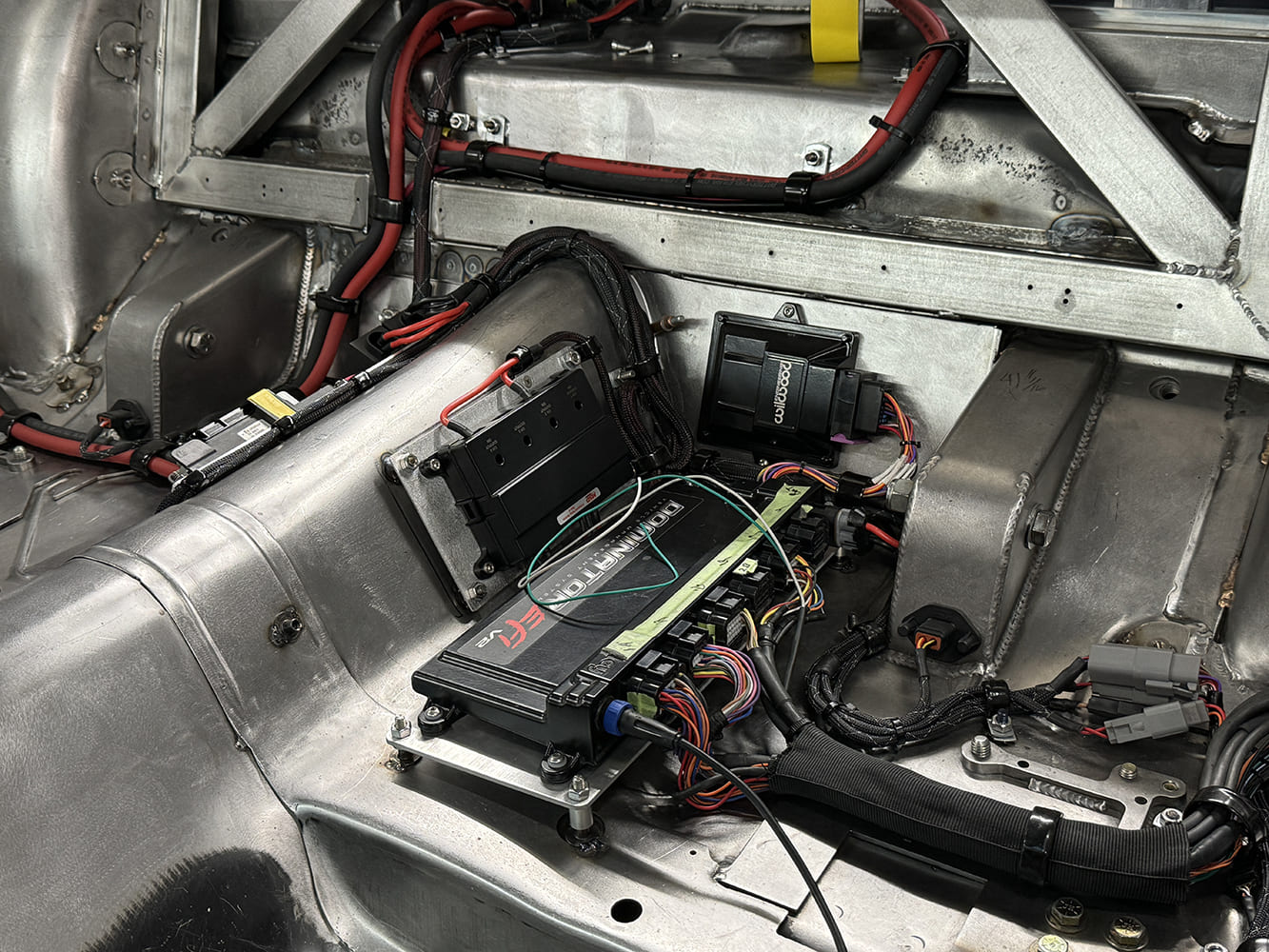 23 1969 Camaro rear seat area electronics with MoTeC and solid state power distribution setup