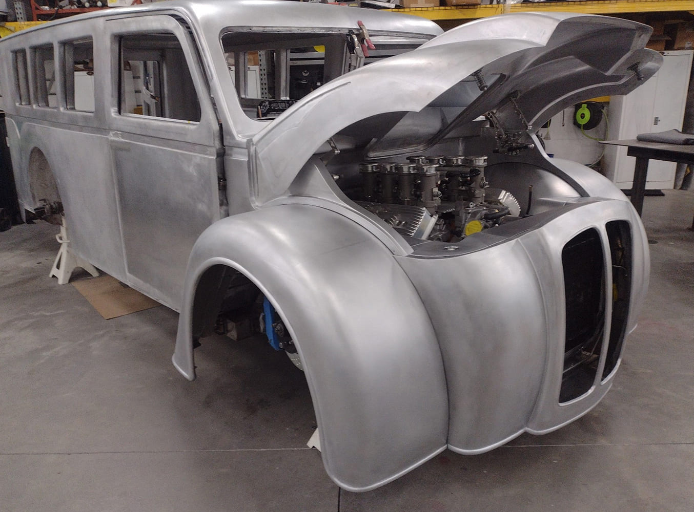 23 Divco front end full mockup with open hood exposing ITB intake and headers