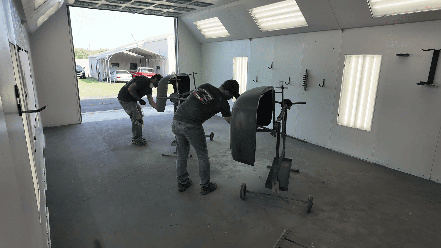 24 1956 Ford F 100 fenders prepped and scuffed in paint booth before base coat