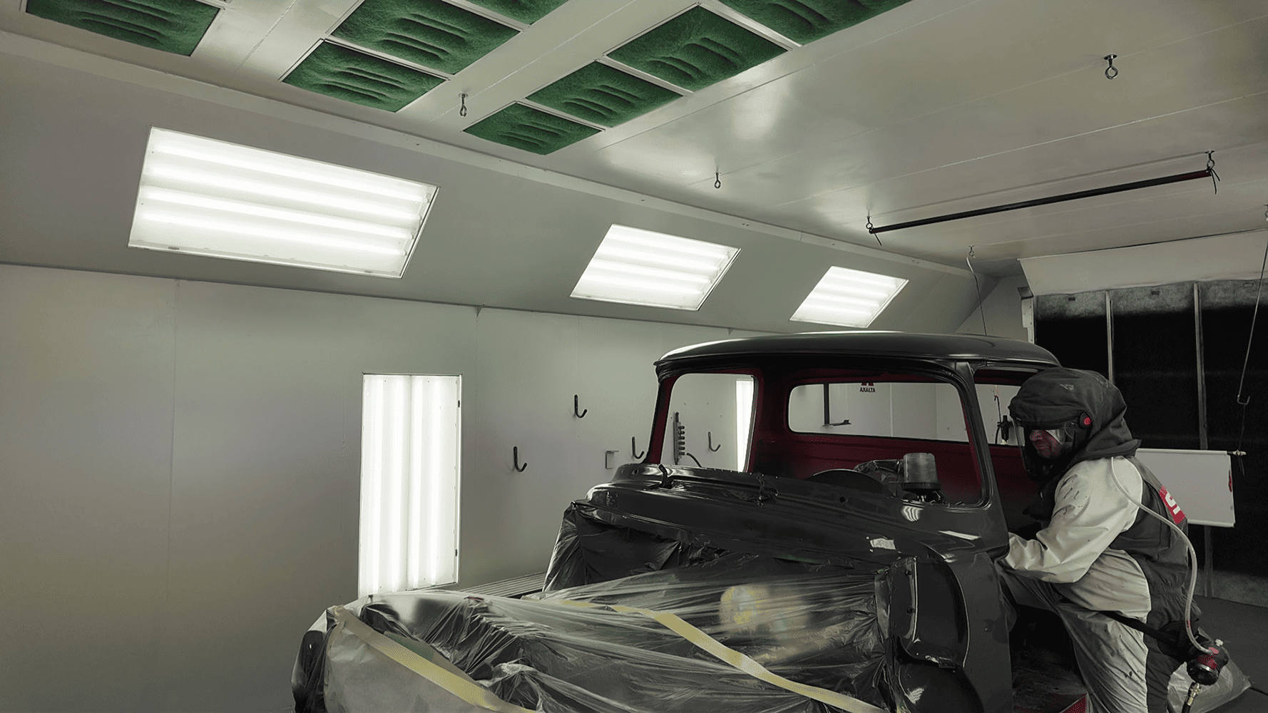 29 1956 Ford F 100 cab masked and sprayed with glossy black topcoat in booth