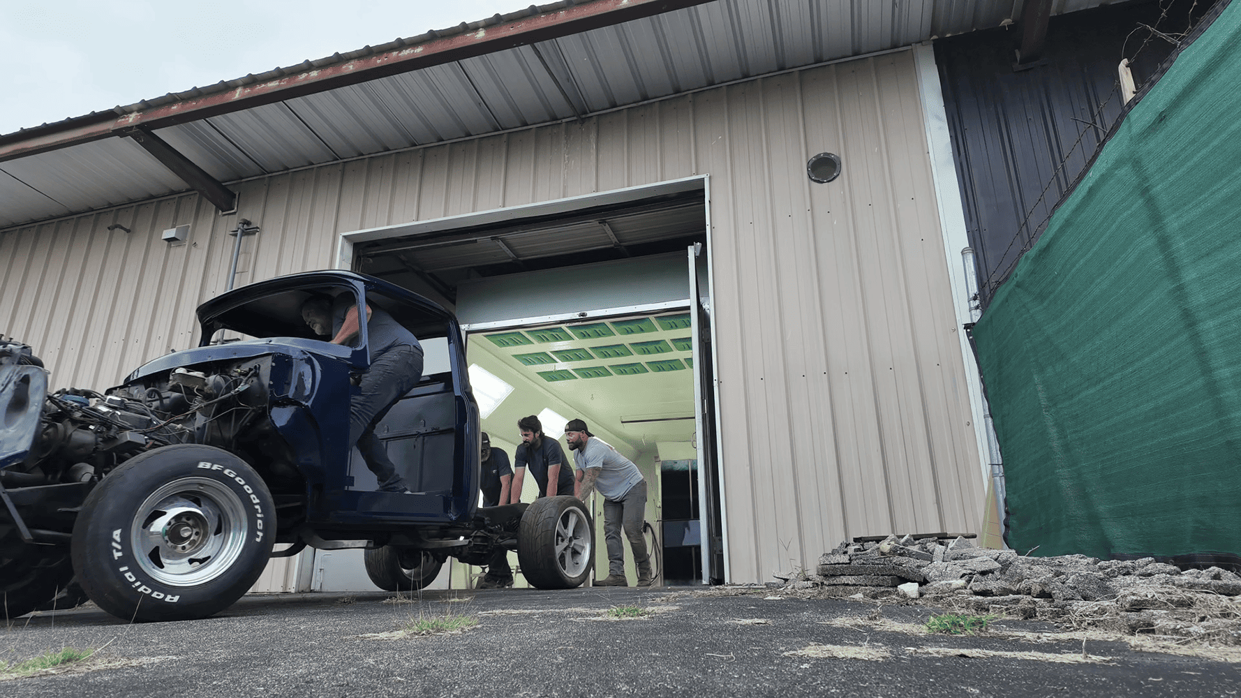 31 1956 Ford F 100 cab rolled out of paint booth with fresh blue finish