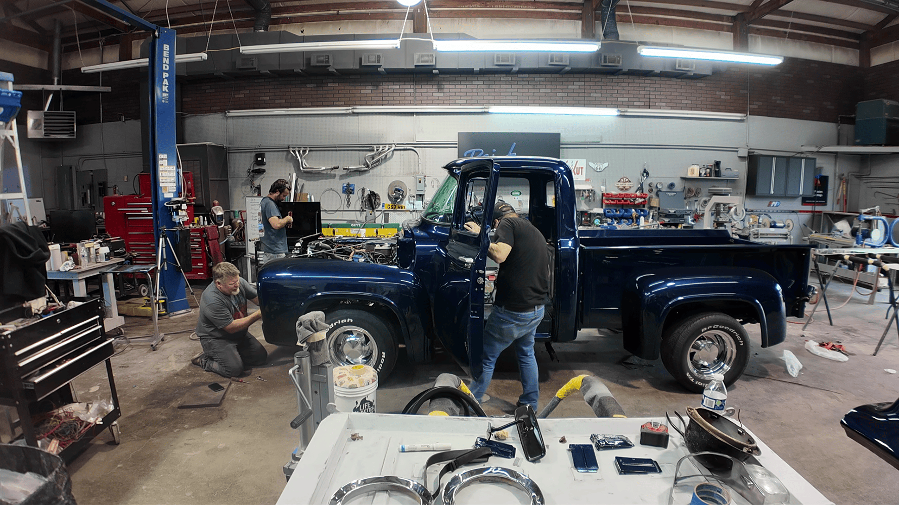 33 1956 Ford F 100 full body assembly and detailing in restoration garage