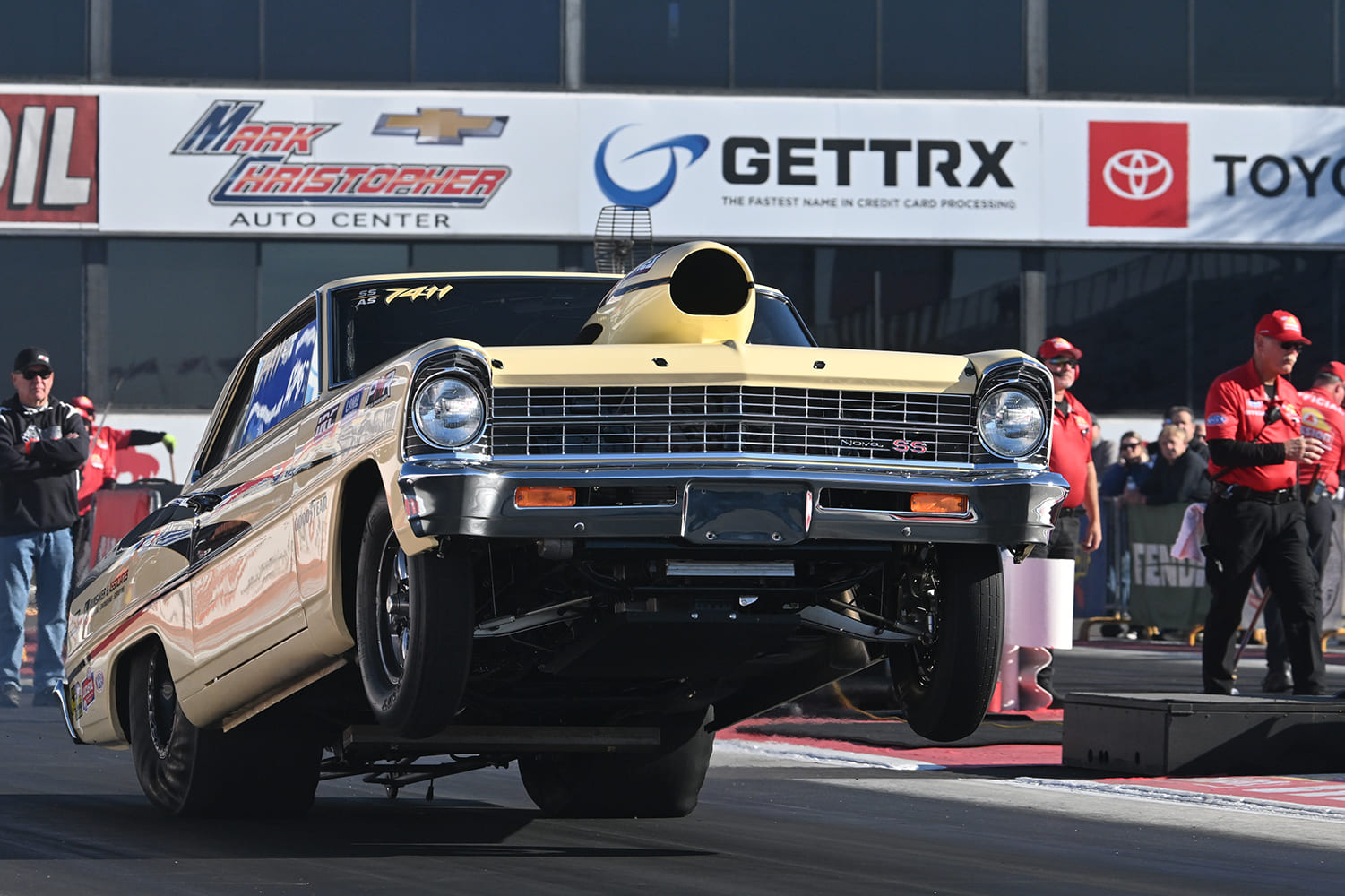 002 1966 nova ss drag launch front wheels up yellow paint track prep pass