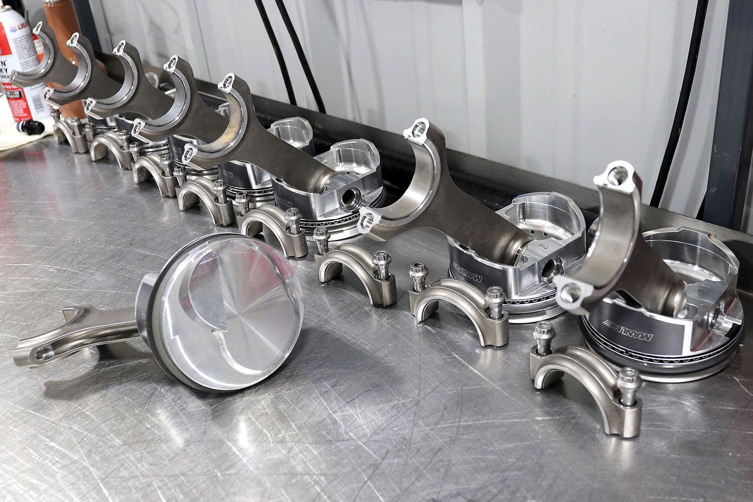 004 Manley forged pistons and rods laid out for high performance engine assembly