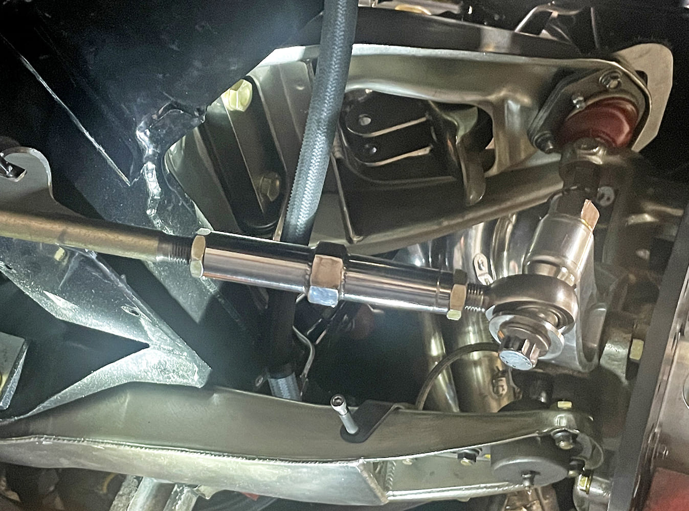 006 steering link heim joint close up with jam nuts and threads