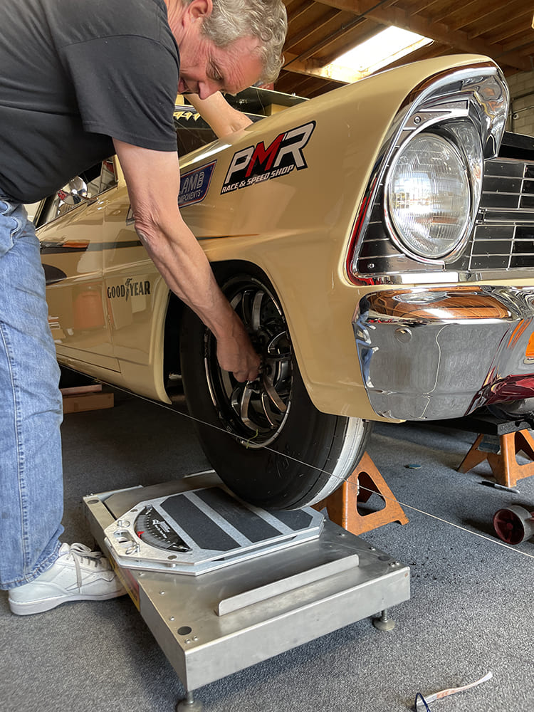 020 checking toe on 1966 nova front wheel using string and digital scale