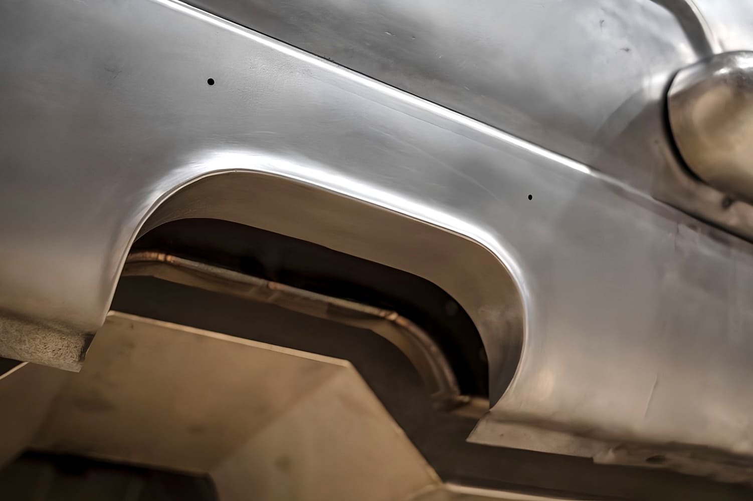 024 1968 Camaro mini tub close up hand formed arch finished raw metal look