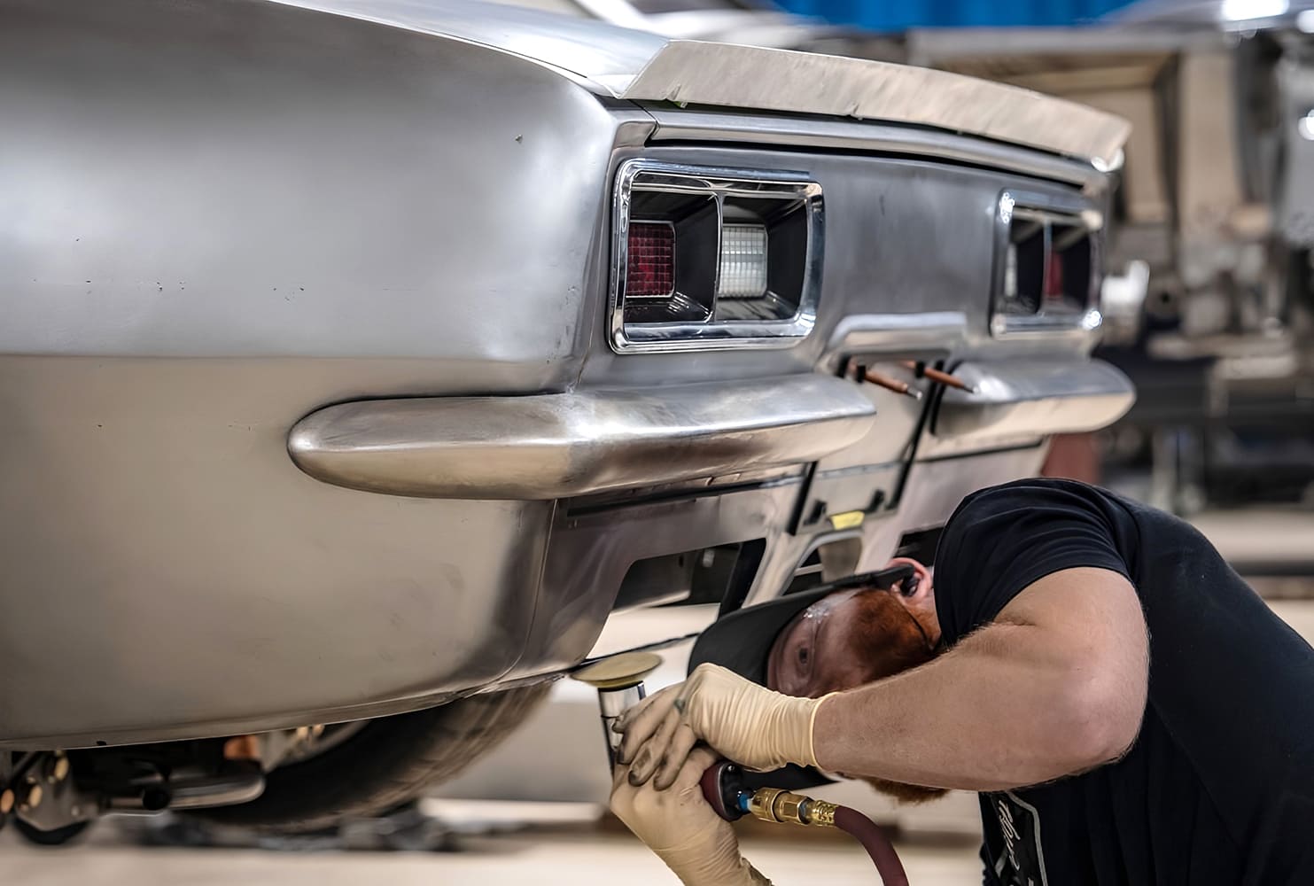 028 1968 Camaro tailpanel shaping air tool detail smoothing slot edge and welds