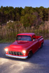 03 1955 chevy truck lowered red stepside with chrome bumper and black steel wheels