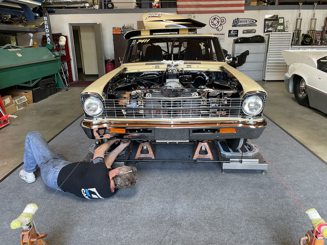030 undercar view of 1966 nova on scales with alignment in progress