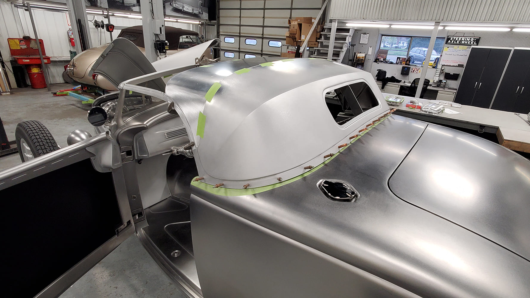 05 1936 Ford Roadster raw aluminum roof skin fitted with clecos coachbuilt metal shaping process