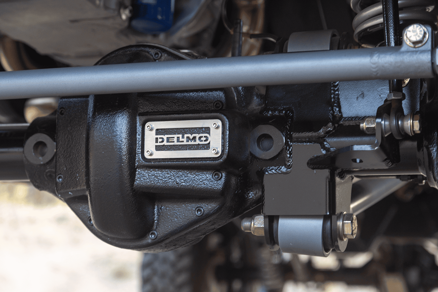 10 1969 Ford F 250 4x4 front end low angle showing lift kit chrome bumper and front suspension components