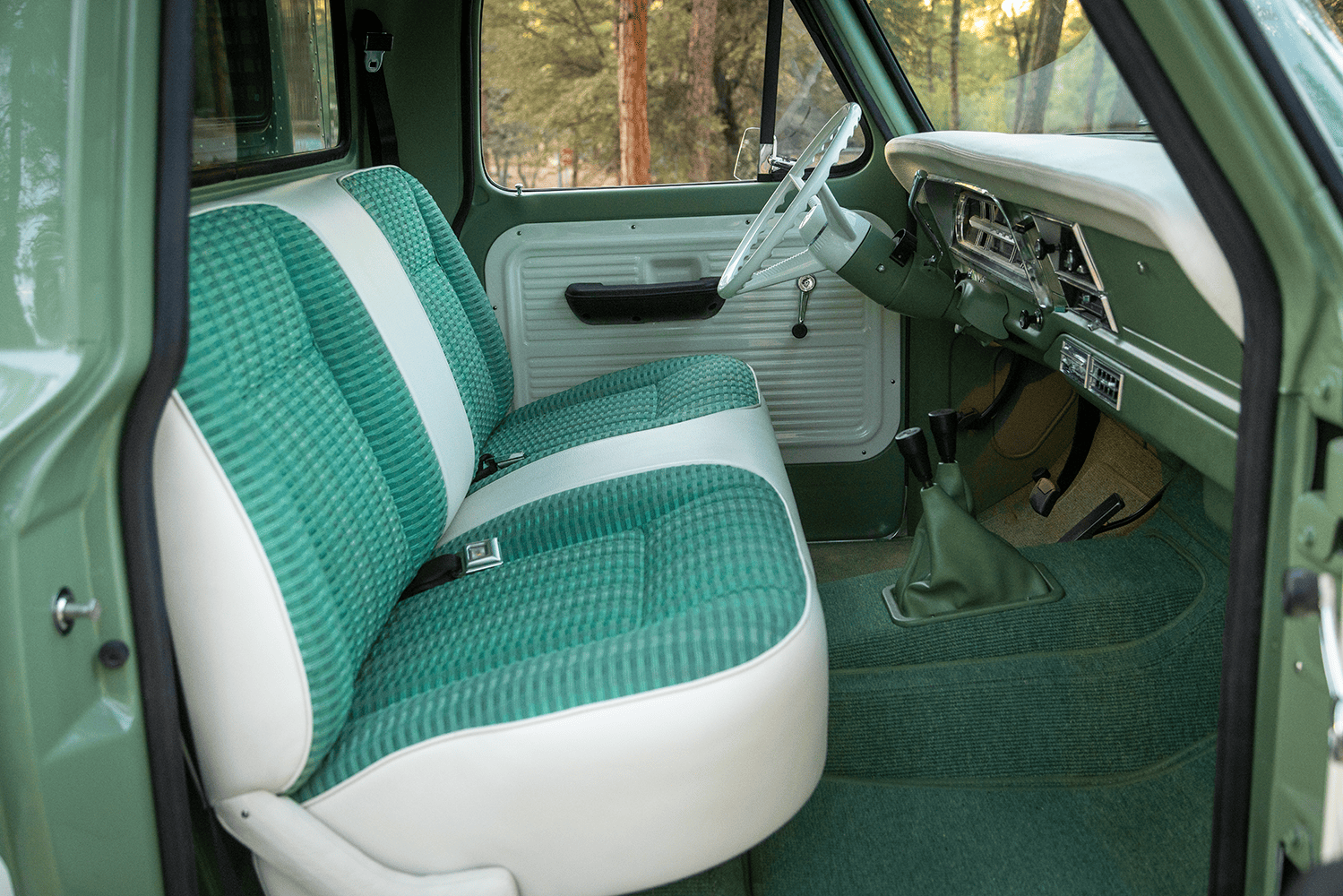 13 1969 Ford F 250 cab interior with green plaid bench seat white accents and original dash layout