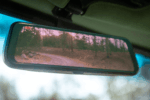 15 1969 Ford F 250 smart digital rearview mirror with integrated camera view of wooded trail