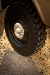 40 1959 Chevrolet Apache close up of rugged tread mud tires with gloss black steel wheels and chrome dog dish caps