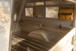 47 1959 Chevrolet Apache truck camper interior with ribbed bed floor aluminum louvered windows and vintage satchel