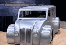 00 Divco custom bare metal widebody wagon build with chopped roof and deep inset grille at Saltworks display