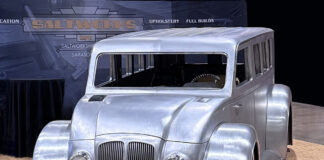 00 Divco custom bare metal widebody wagon build with chopped roof and deep inset grille at Saltworks display