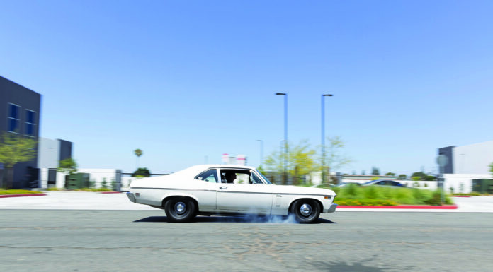 000 1969 Chevy Nova burnout black steelies street action shot