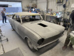 001 1963 Chevy Nova body in primer at shop roof masked hood cutout
